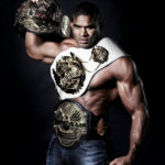 Alistair Overeem with three championship belts