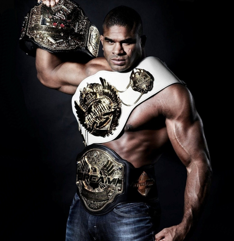Alistair Overeem with three championship belts