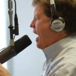 Kevin Price speaking into microphone
