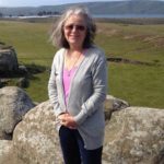 Pauli Halstead standing in front of green field