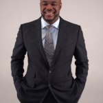 Rashad Evans with suit and hands in pockets